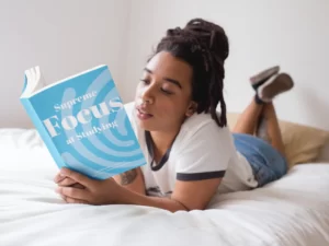 a woman reading supreme focus book